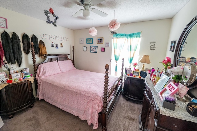 carpeted bedroom with a textured ceiling and ceiling fan