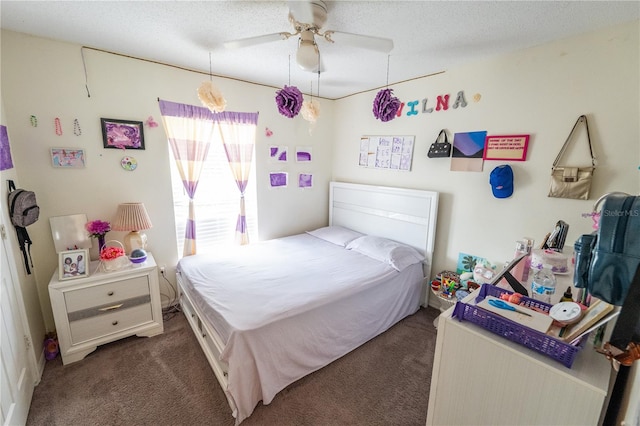 carpeted bedroom with ceiling fan and a textured ceiling