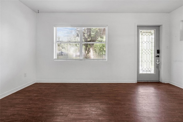 entryway with dark hardwood / wood-style flooring