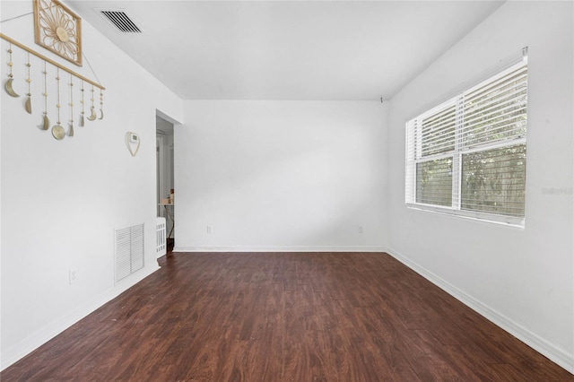 empty room featuring dark hardwood / wood-style floors