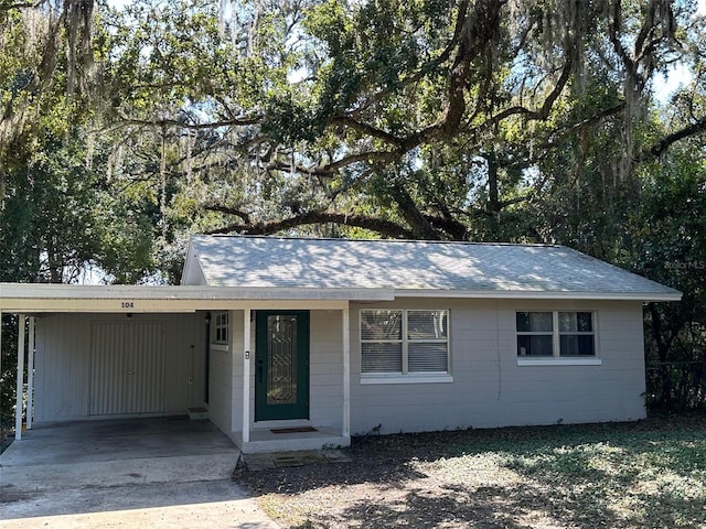 ranch-style house with a carport