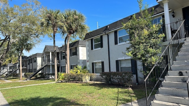 7622 Forest City Rd Unit E, Orlando, FL 32810 - view of property with stairway and a residential view