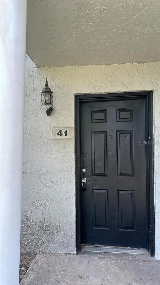 7622 Forest City Rd Unit E, Orlando, FL 32810 - property entrance featuring stucco siding