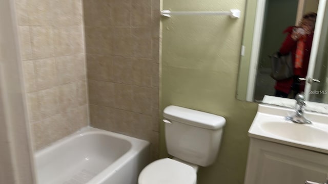 7622 Forest City Rd Unit E, Orlando, FL 32810 - bathroom featuring toilet, vanity, and shower / bath combination