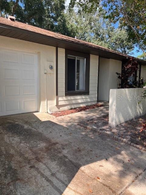 view of exterior entry featuring a garage