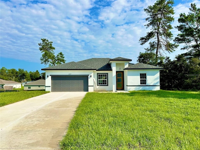 view of front of home featuring a garage and a front lawn