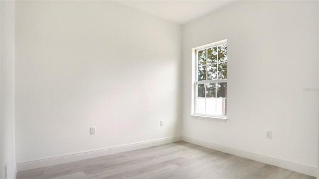 unfurnished room with light hardwood / wood-style flooring