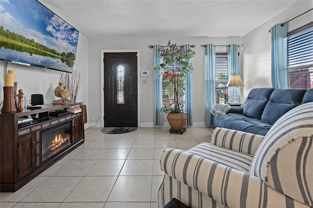 living room with light tile patterned floors and a textured ceiling