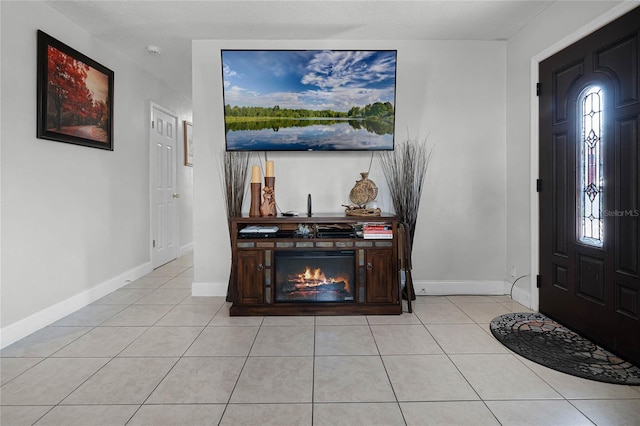 foyer entrance with light tile patterned floors and plenty of natural light