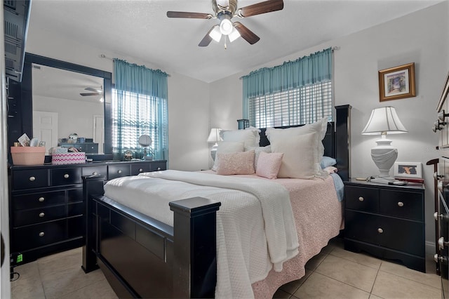 bedroom featuring light tile patterned flooring and ceiling fan