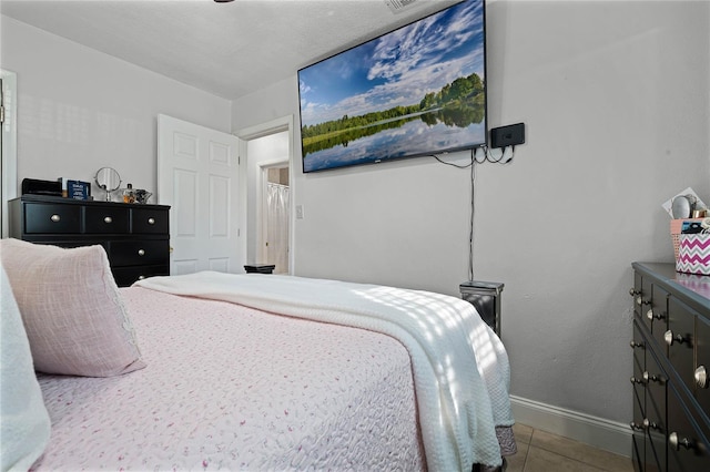 bedroom with tile patterned flooring