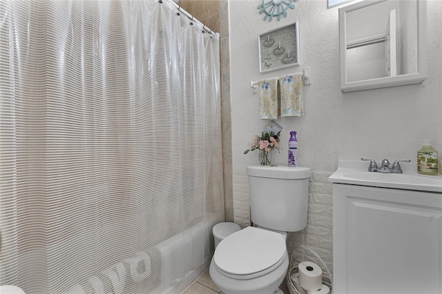 bathroom with tile patterned floors, vanity, and toilet