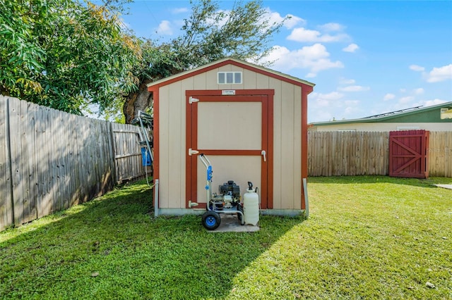 view of outbuilding with a yard