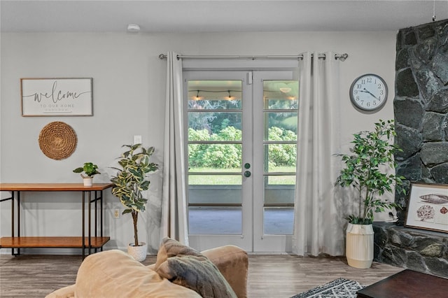 entryway with french doors and hardwood / wood-style flooring