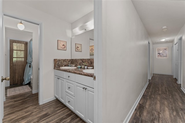 interior space with hardwood / wood-style floors and vanity