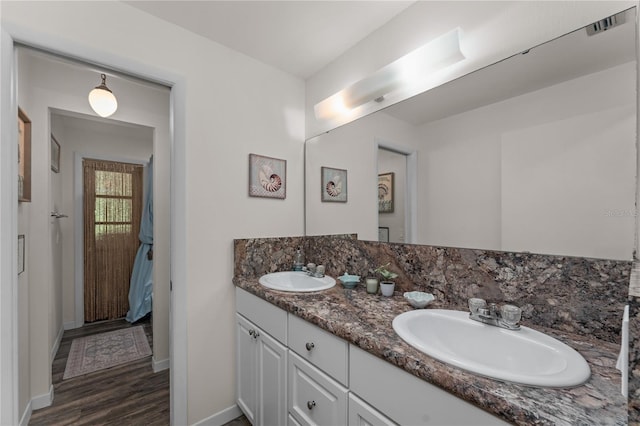 bathroom with wood-type flooring and vanity