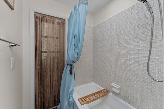 bathroom featuring shower / tub combo with curtain