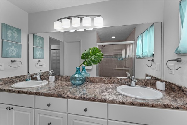 bathroom with vanity and an enclosed shower