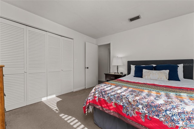 bedroom with carpet and a closet