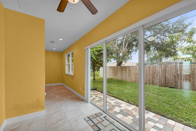 doorway to outside with ceiling fan