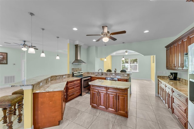 2416 SE 8th Ave, Cape Coral, FL 33990 - kitchen featuring wall chimney range hood, electric stove, ceiling fan, and a sink