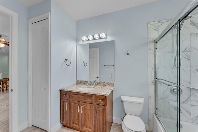 full bathroom with vanity, enclosed tub / shower combo, and toilet