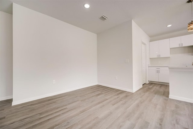 unfurnished living room with light hardwood / wood-style floors