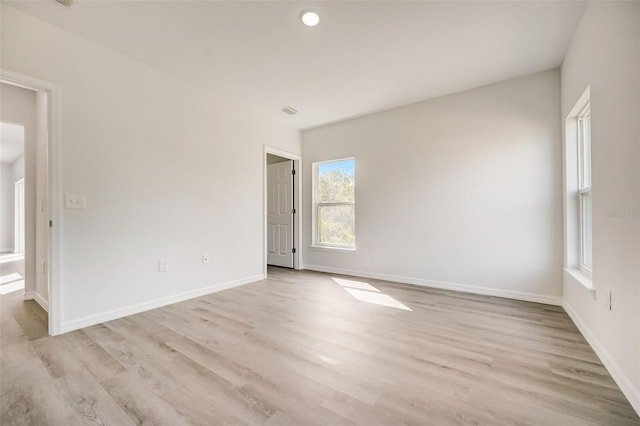 unfurnished room featuring light wood-type flooring