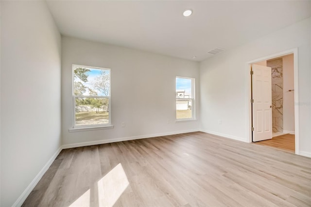 unfurnished room featuring light wood-type flooring