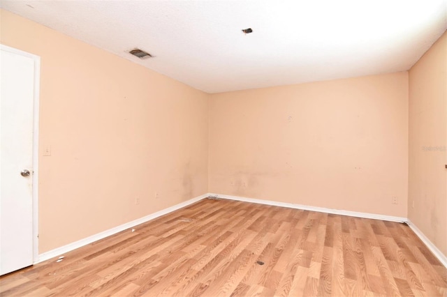 unfurnished room featuring light hardwood / wood-style flooring