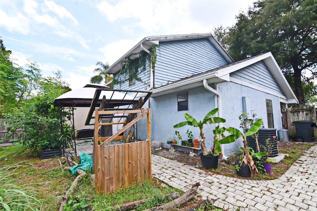 view of home's exterior with cooling unit