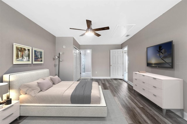 bedroom featuring ceiling fan, connected bathroom, and dark hardwood / wood-style floors