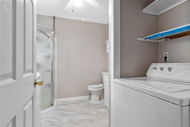 bathroom with ceiling fan, walk in shower, vanity, toilet, and washer / clothes dryer