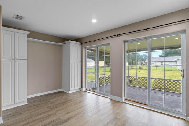 entryway with light hardwood / wood-style floors