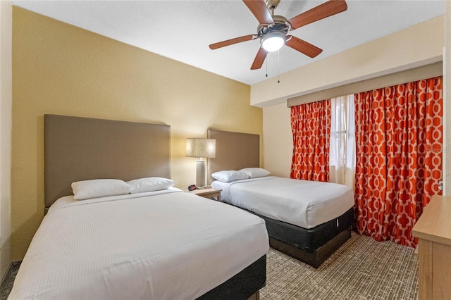 12556 Floridays Resort Dr Unit 207-A, Orlando, FL 32821 - bedroom with a ceiling fan and wood finished floors