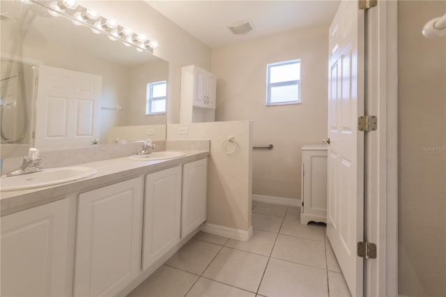 bathroom featuring vanity, plenty of natural light, and tile patterned flooring