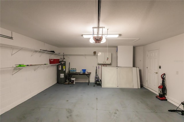 garage with a garage door opener and electric water heater