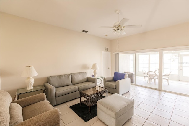 living room with light tile patterned flooring and ceiling fan