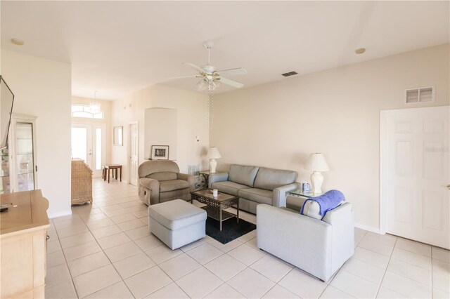 tiled living room featuring ceiling fan