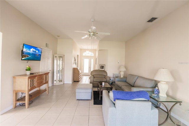 tiled living room with ceiling fan