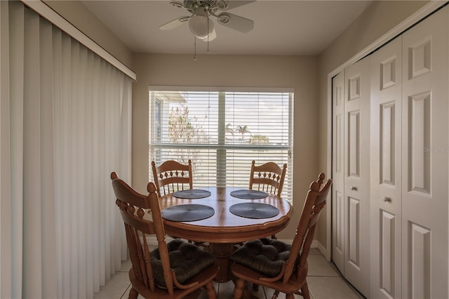 tiled dining room with ceiling fan