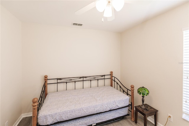 bedroom featuring ceiling fan and hardwood / wood-style floors