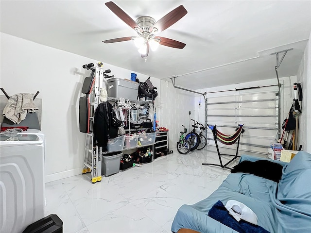 garage featuring ceiling fan and washer / dryer