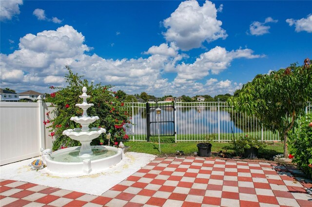 view of patio / terrace with a water view