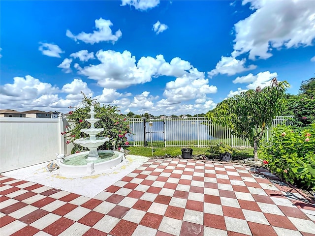 view of patio / terrace featuring a water view