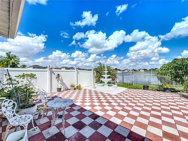 view of patio / terrace with a water view