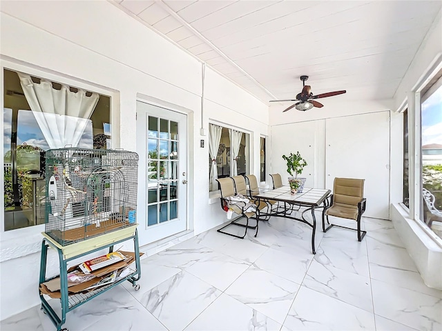 sunroom / solarium with ceiling fan