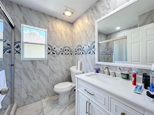 bathroom with toilet, tiled shower, tile walls, and vanity