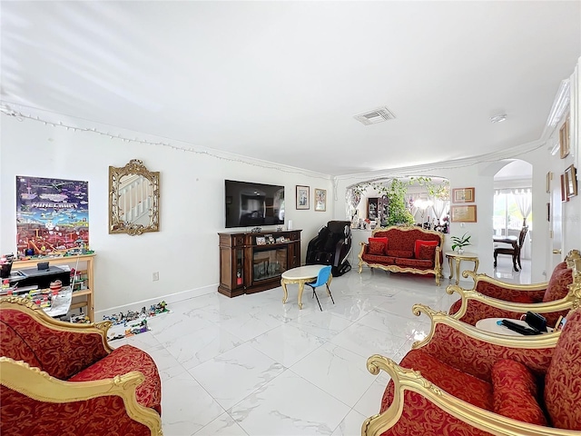 living room with ornamental molding