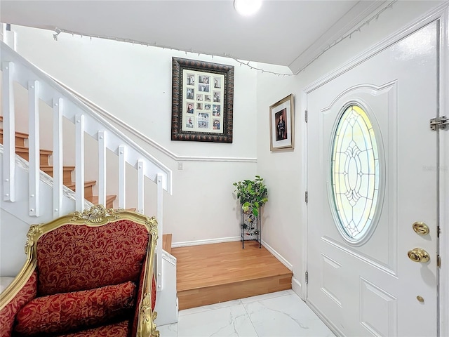 entryway featuring ornamental molding